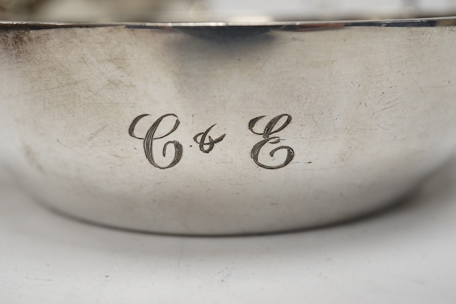 A silver quaich, E J Gallichan & Co Ltd, Sheffield, 1962, diameter 10.2cm, together with a silver sauceboat and a small silver dish, 10.1oz. Condition - fair